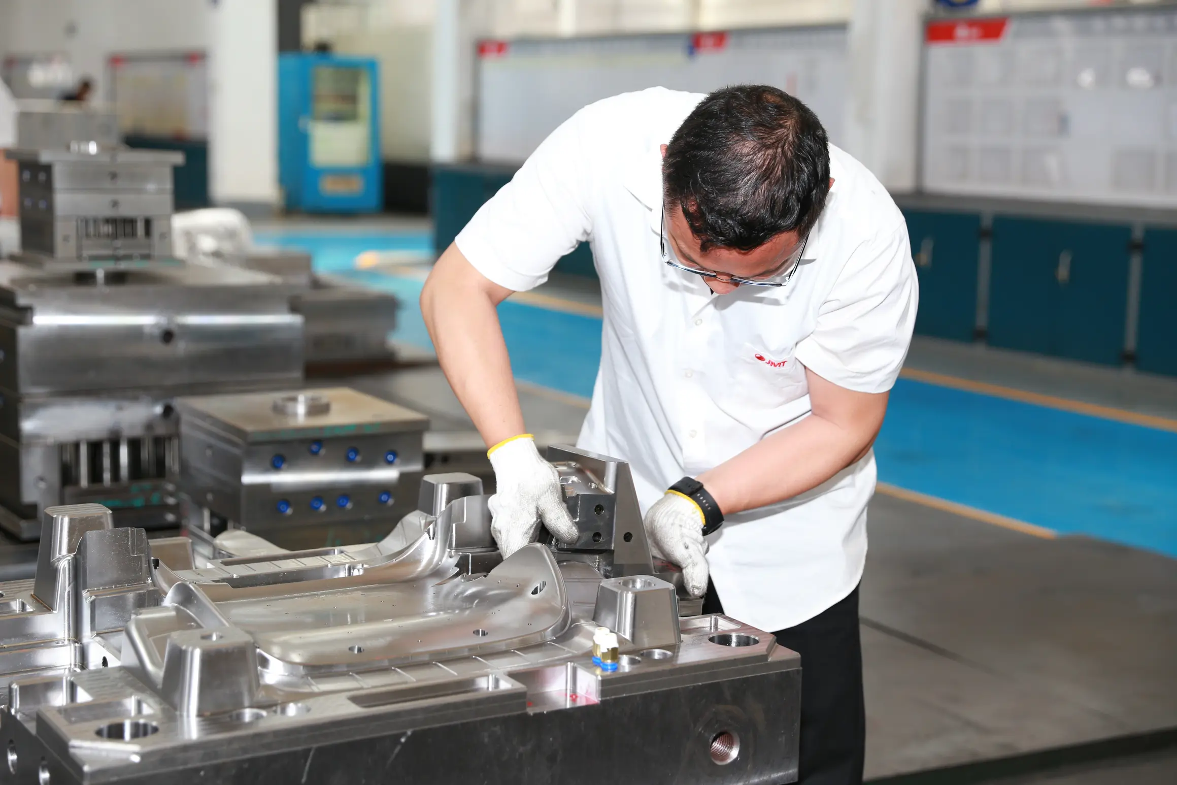 Technician inspecting a mold
